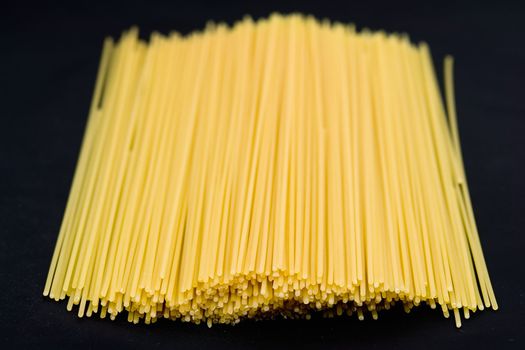 Macaroni background. Yellow spaghetti close up.