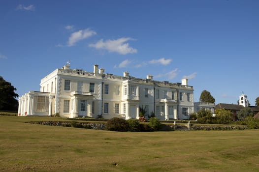 A large white house in the countryside