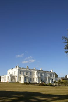 A large white house in the countryside