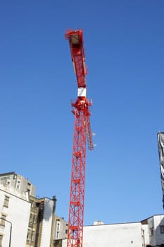 A construction crane aganst a blue sky