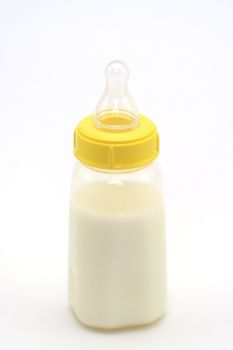 Baby bottle shot against a white background.