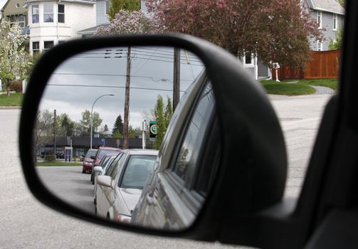 Side mirrors of cars lining up