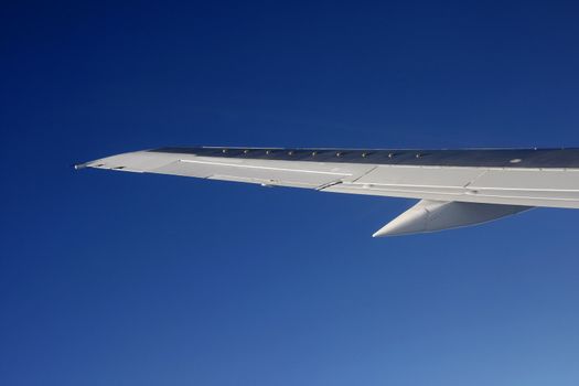 Wing of an aeroplan in the blue sky