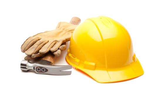 Yellow Hard Hat, Gloves and Hammer Isolated on White.
