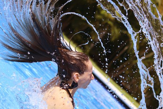 woman takes a bath in the swimming pool