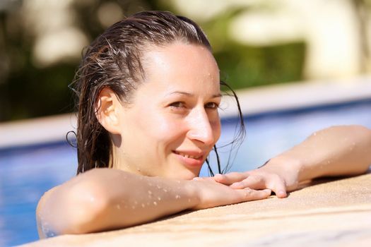 woman on the edge of the swimming pool