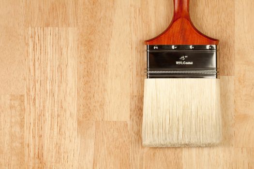 Paint Brush on a Wood Surface with Copy Room.