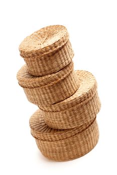 Stack of Various Sized Wicker Baskets Isolated on White.