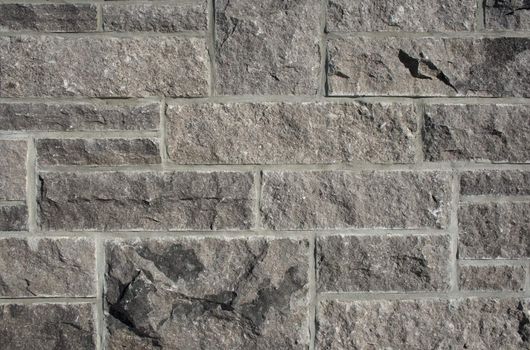 Stone wall background � different sizes of stones and cement.