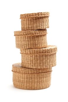 Stack of Various Sized Wicker Baskets Isolated on White.