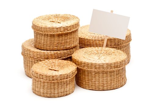Various Sized Wicker Baskets with Blank Sign Isolated on White.