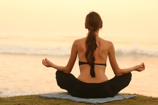 yoga and breath exercises by the sunset