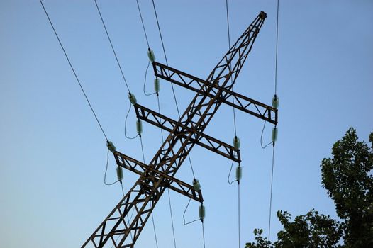 high volts power line on blue sky with insulators and wires