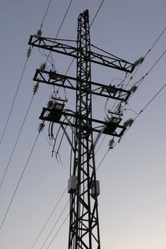 high volts power line on blue sky with insulators and wires