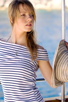 Beautiful young woman on a daily boat trip