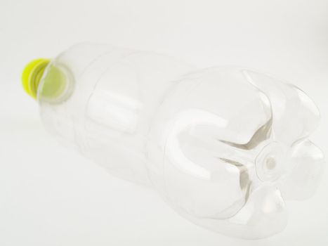 PVCu Plastic Bottle With Green Cap Screwed on Clear Bottle Isometric View Facing Away