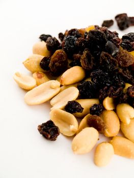 Stack Pile of Peanuts and Raisins on White Background No Shells or Coating