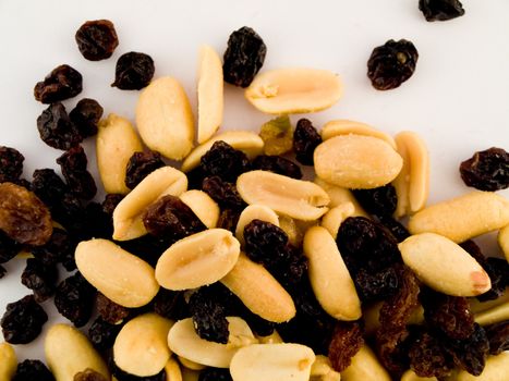 Stack Pile of Peanuts and Raisins on White Background No Shells or Coating