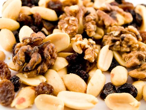 Close Up Walnuts Peanuts and Dried Fruit on White Background Macro Near