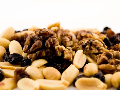 Close Up Walnuts Peanuts and Dried Fruit on White Background Macro Near