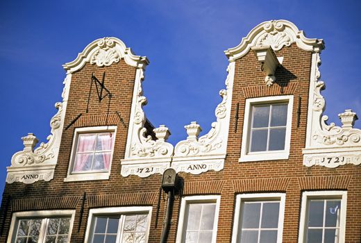 Two ornate brick houses in Amsterdam, The Netherlands. 