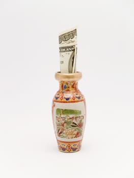 Chinese vase and dollars