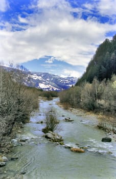 Icy cold water rushes through the Austrian Alps.