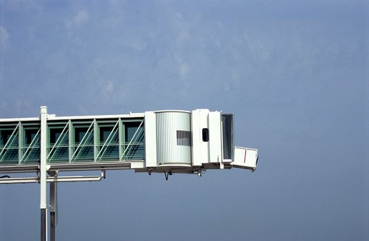 A retracable pedway is used to load and unload passengers from cruise ships and aircraft.