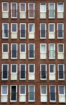 Narrow windows adorn a modern condominium in Amsterdam, the Netherlands