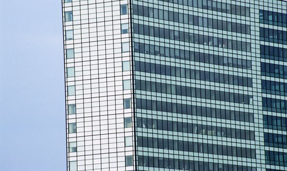 A modern office tower overlooks the Ij canal in Amsterdam, The Netherlands.