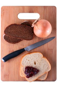 Useful and harmful products at the control over a body weight on a kitchen chopping board.