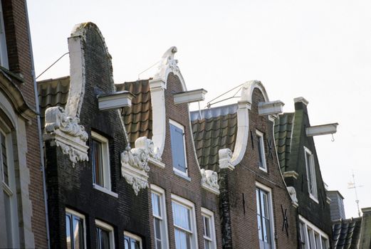 Hooks for lifting furniture are a common feature of Amsterdam's traditional canal houses.