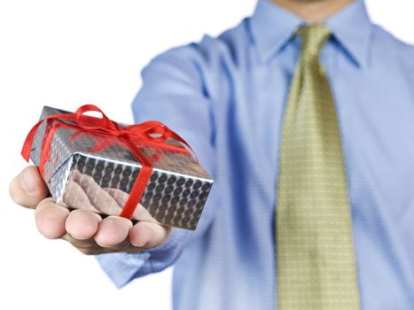 Office guy holding a gift with a red satin bow.