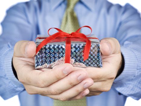 Office guy holding a gift with a red satin bow.