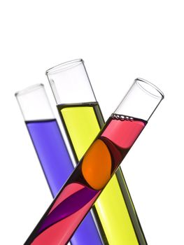 Three test tubes filled with colored liquids. Isolated on white.