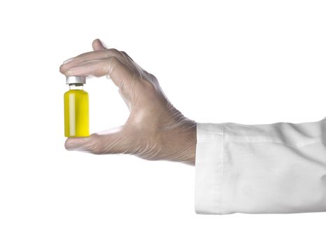 A doctor holds a vial full of yellow liquid with his latex gloves on. Isolated on white.