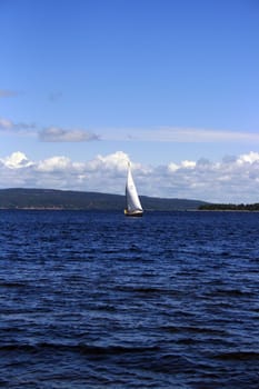 a sail boat nearing the harbour in Holmestrand, Norway.