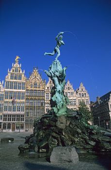 The town square of Antwerp, Belgium including the city hall, guild houses and famous fountain.