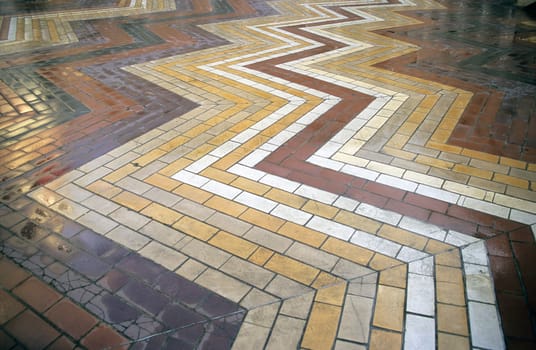 A star pattern in multi-coloured bricks