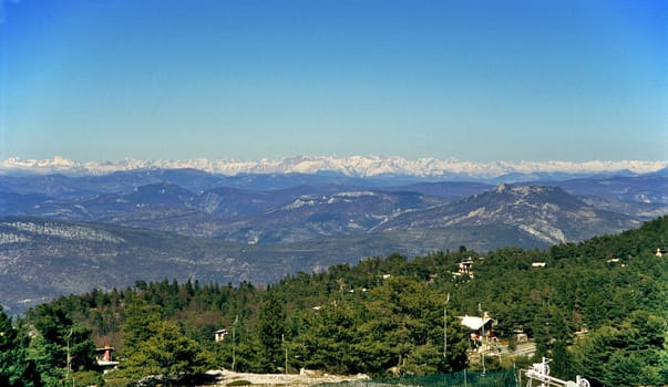 A view of the snow capped French Alps from Mount Ventoux in spring.