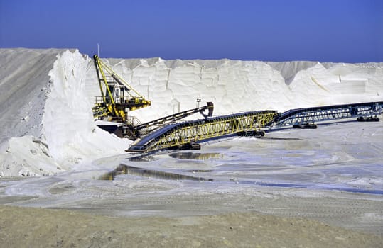 Giant conveyors transport salt from the mountains harvested in Salin de Giraud, Camargue, France.