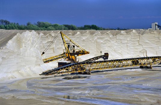 Giant conveyors transport salt from the mountains harvested in Salin de Giraud, Camargue, France.