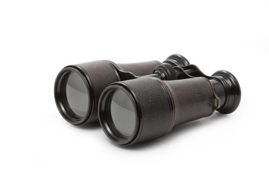 Old black binoculars isolated on white background with clipping path