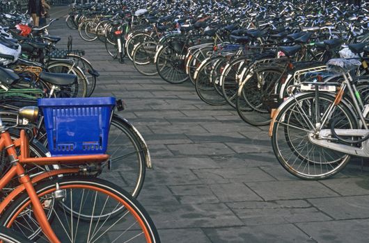 A bicycle parking lot near central station in Amsterdam - bikes are an environmantally friendly mode of urban transportation. 