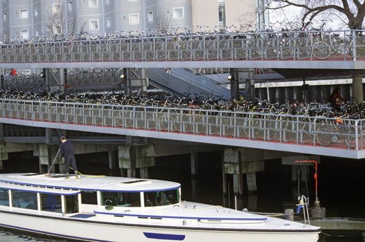 A bicycle parking lot near central station in Amsterdam - bikes are an environmantally friendly mode of urban transportation.