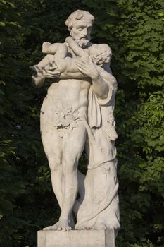 monument of an old man with a child on his hands