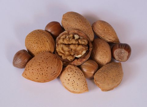 Mixed nuts on a grey background