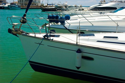 Group of luxury yachts moored in marina at Greece