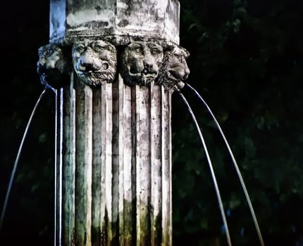 the old ancient fountain in the night