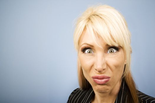 Businesswoman in a pinstripe suit making a funny face